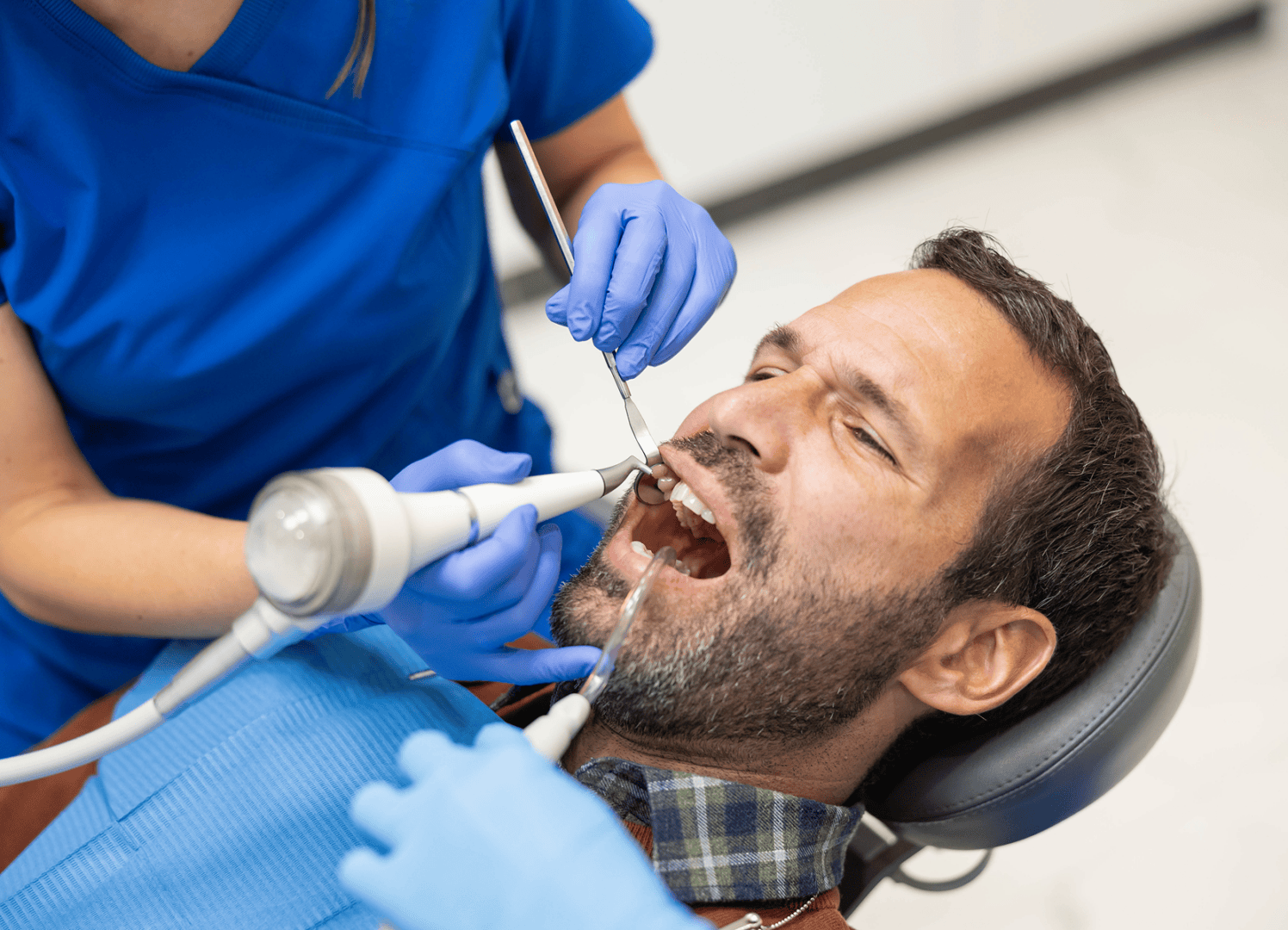 Patient receiving dental treatment in clinic.